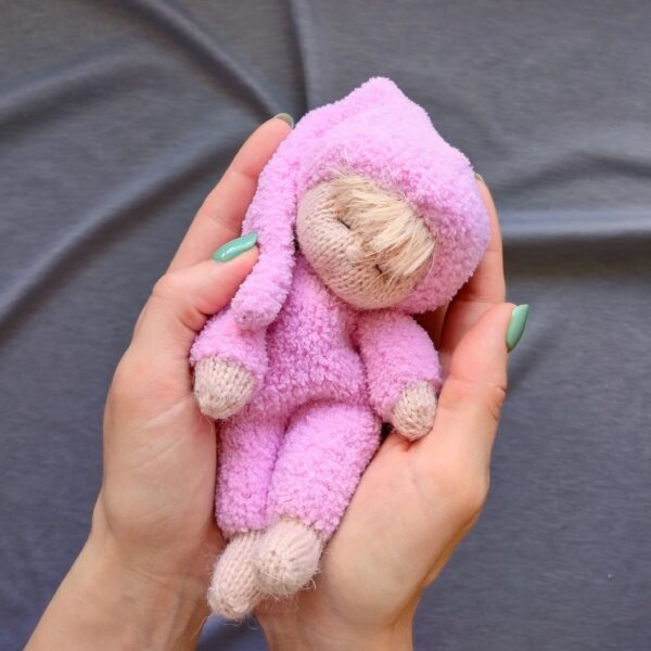 A small knitted toy doll. Dubovkinworkshop