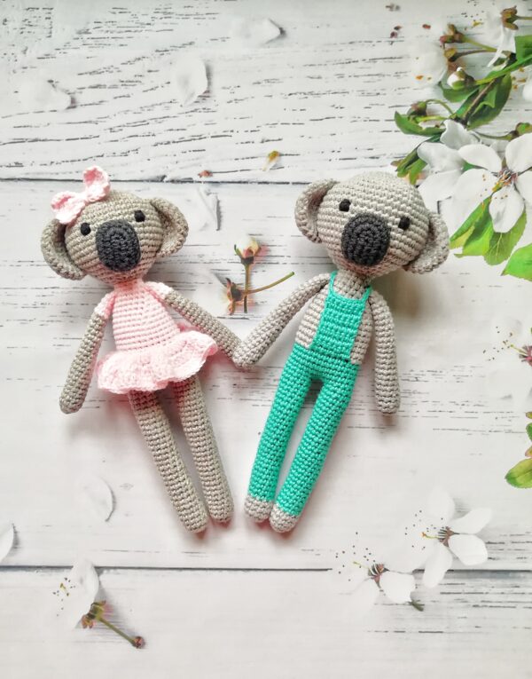 Crochet amigurumi koala in a dress and overalls