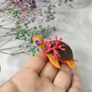 Handmade turtle art on palm