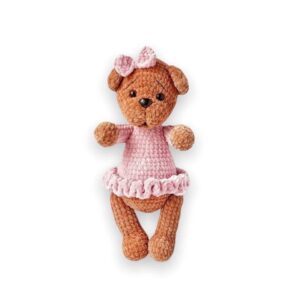 Plush amigurumi crochet teddy bear in a dress pattern
