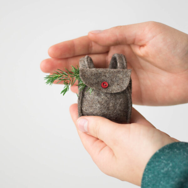 mini felt doll backpack in hands