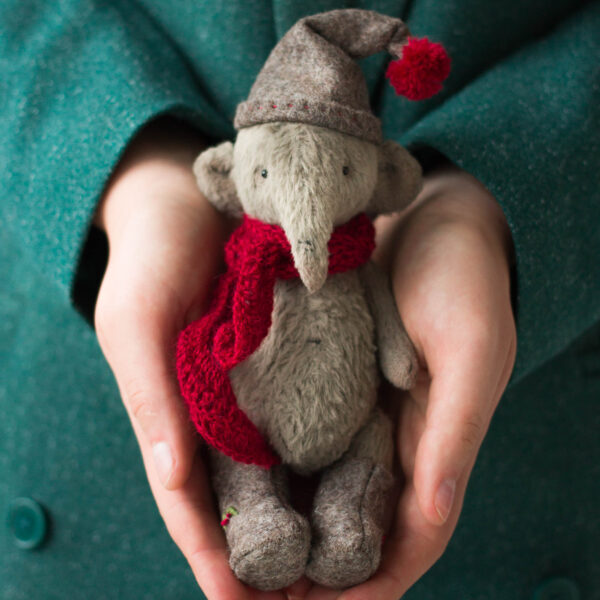 elf doll elephant in hands