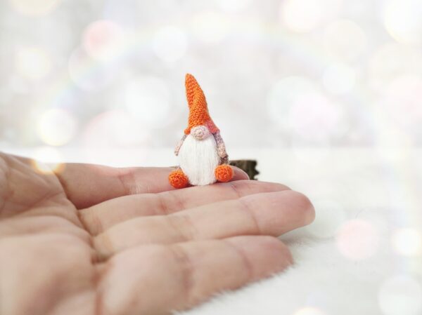 orange miniature knitted Scandinavian gnome brings good luck