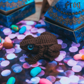 Chocolate frog. Knitted toy.
