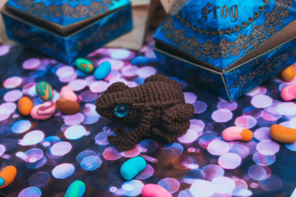 Chocolate frog. Knitted toy.