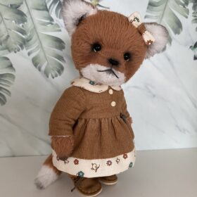 Author's red fox Lilu in a beautiful dress. Cute plush handmade fox.