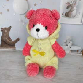 pink teddy bear in overalls