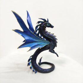 Blue dragon figure. Side view