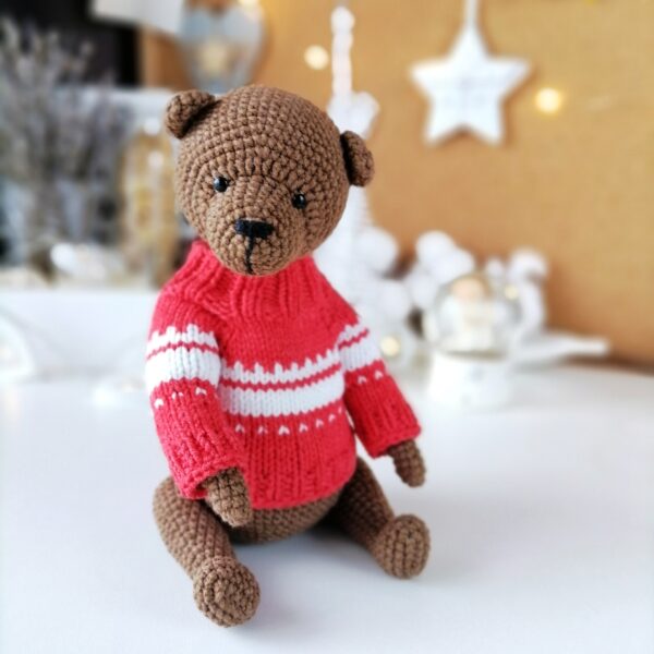 Teddy Bear in red sweater sitting