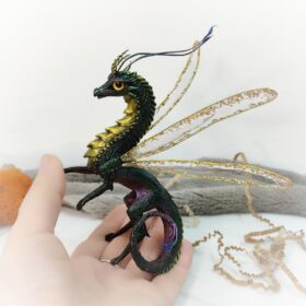 Fantasy dragon. View on palm
