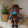Crochet pattern of Cad Bane amigurumi toy from Star Wars. Handmade soft bounty hunter doll with hat and breathing tubes.
