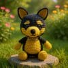 Amigurumi German Shepherd puppy crocheted with black and golden-brown yarn, sitting upright with large safety eyes, pointed ears, and a cute bow. The image shows the final result of a digital crochet pattern. Includes many detailed photos to guide your crochet step by step. Perfect for dog lovers and crafters.
