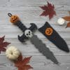 Crochet pattern for Halloween dagger with skull and pumpkin handle, and sheath