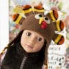 An 18-inch doll in a cute crocheted turkey hat