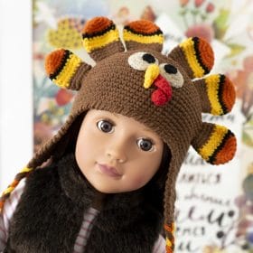 An 18-inch doll in a cute crocheted turkey hat