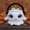 Crochet pattern of a cute Halloween cauldron with big eyes and lashes