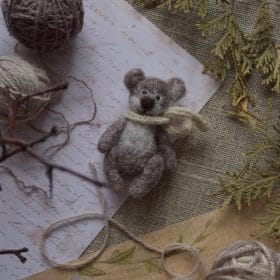 Miniature teddy bear lies in the interior