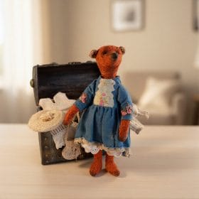 Vintage teddy bear with clothes.